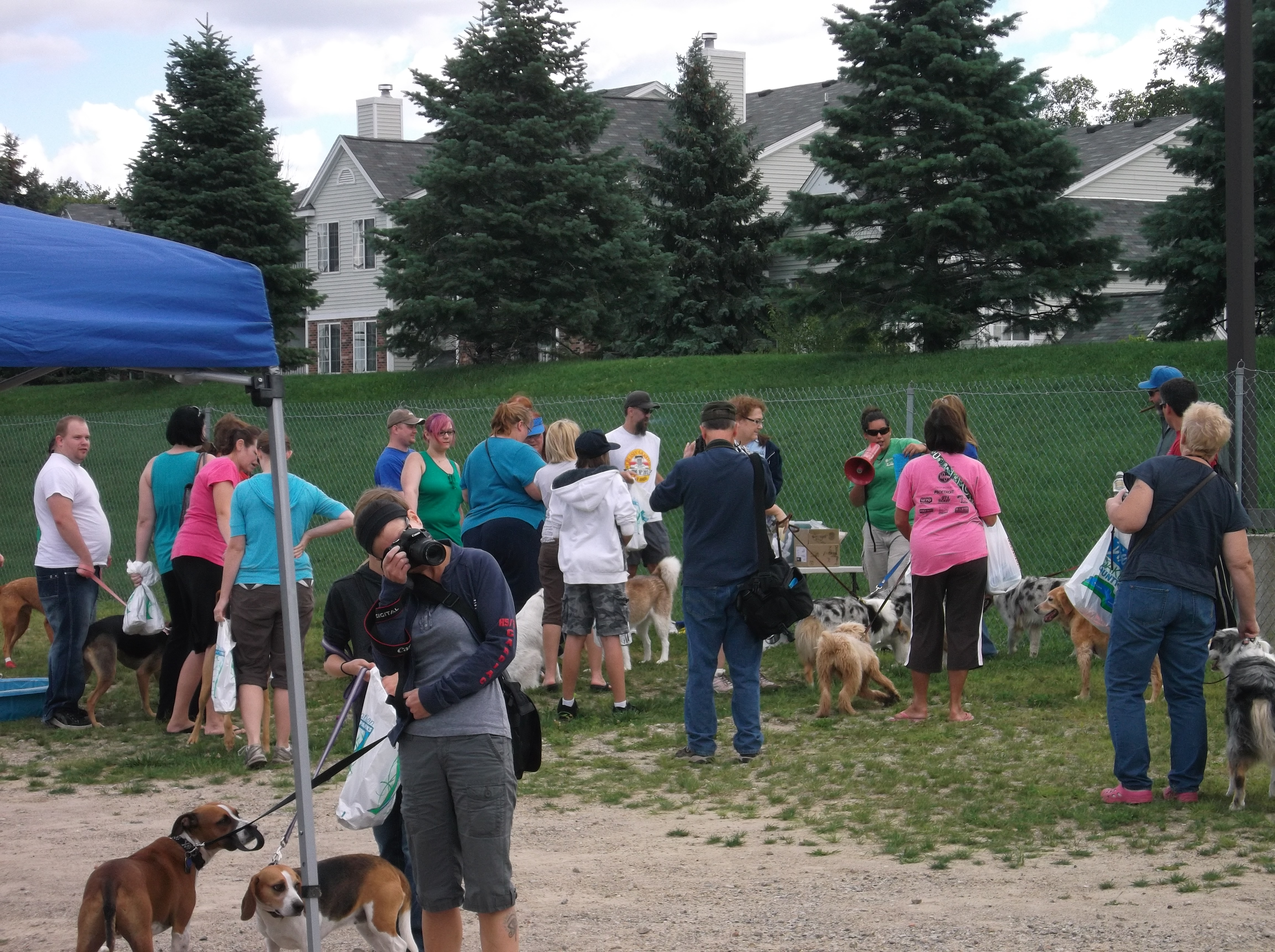 Attendees spend time at the Red Oaks dog park.