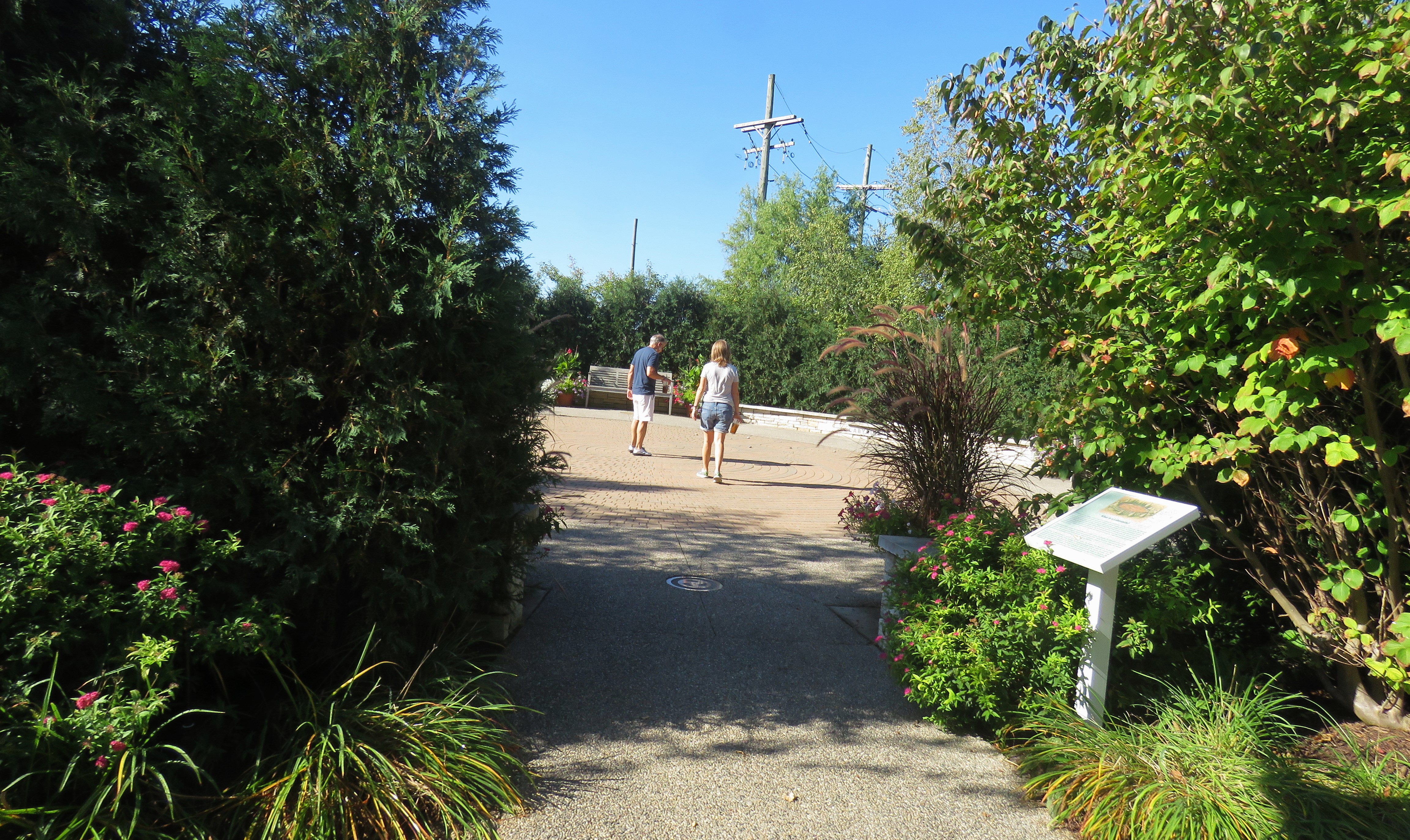 Two people walking in McLaren Healing Garden