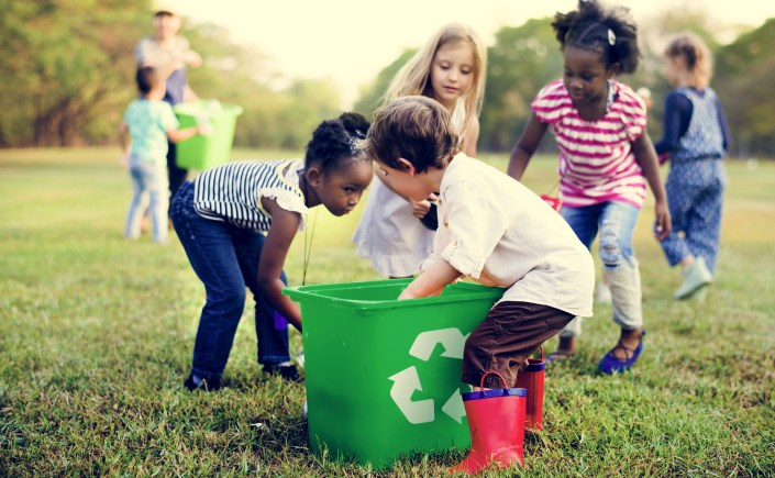 Group of kids with recycling bins