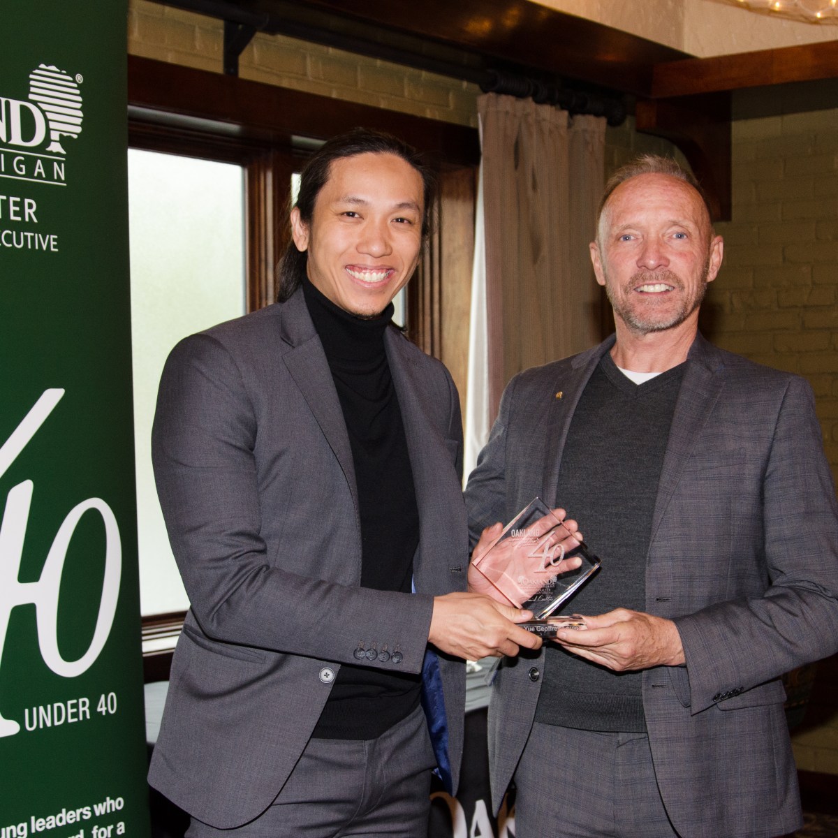 40 Under 40 award recipient Dr. Wing-Yue Geoffrey Louie and Oakland County Executive Dave Coulter
