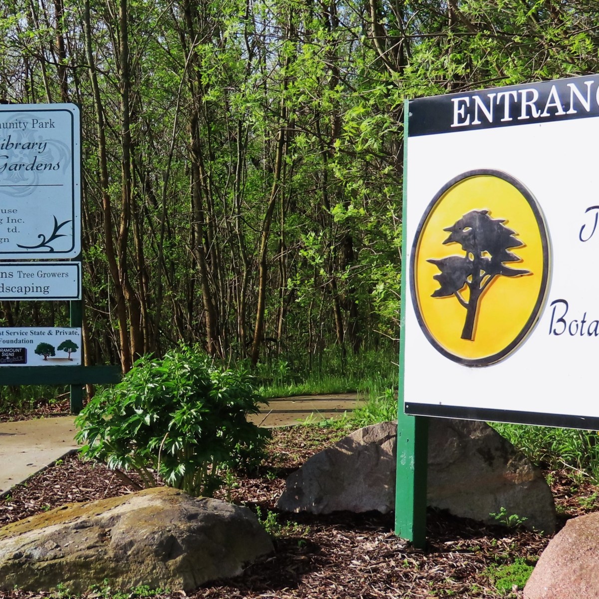 Entrance signs to Tree Library and Botanical Gardens at Brandon Township Community Park