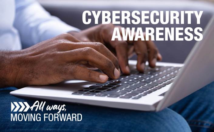 photo of someone using laptop with message that reads "Cybersecurity Awareness"