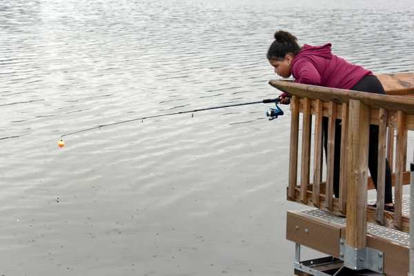 Girl fishing at Independence Oaks. 